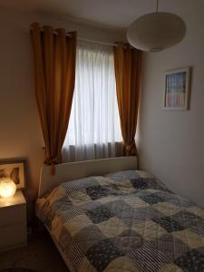 a bedroom with a bed in front of a window at Weitblick in Sankt Andreasberg