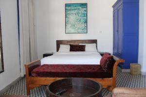 Postel nebo postele na pokoji v ubytování Hôtel Central