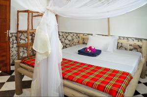 Postel nebo postele na pokoji v ubytování Kimte Beach Lodge