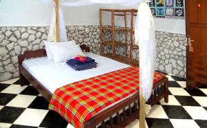Postel nebo postele na pokoji v ubytování Kimte Beach Lodge