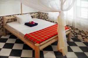 Postel nebo postele na pokoji v ubytování Kimte Beach Lodge