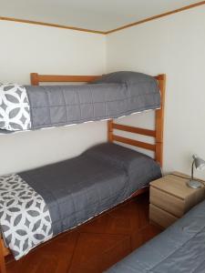 Postel nebo postele na pokoji v ubytování Cabaña Tongariki