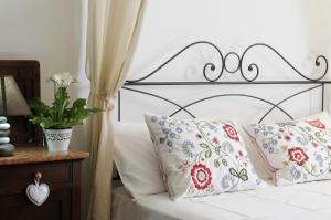 Postel nebo postele na pokoji v ubytování Le Tartarughe rooms