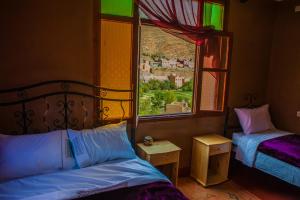 Llit o llits en una habitació de Les Jardins De Todgha gorges de todra tinghir