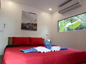 מיטה או מיטות בחדר ב-Ozone Beach Huts
