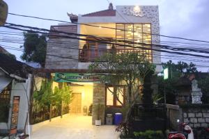 a building with power lines in front of it at Green Studio Apartment Seminyak in Seminyak