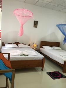 Posteľ alebo postele v izbe v ubytovaní Siyapath Holiday Resort
