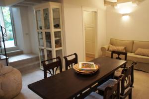 a living room with a table and chairs and a couch at Holiday home Villa Vanya in Mali Ston