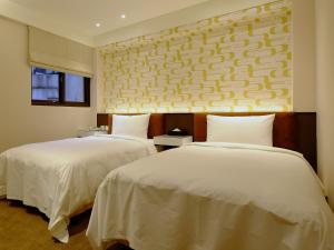 Letto o letti in una camera di Hotel Puri Taipei Station Branch