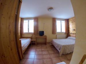 Postel nebo postele na pokoji v ubytování Hotel restaurant Le Chamois