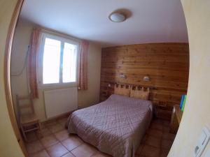 Postel nebo postele na pokoji v ubytování Hotel restaurant Le Chamois