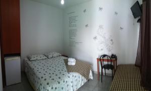 En eller flere senger på et rom på Pousada Casagrande - São João