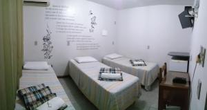 Un pat sau paturi într-o cameră la Pousada Casagrande - São João