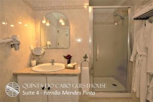 a bathroom with a sink and a shower at Quinta do Cabo Guesthouse in Sintra