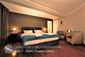 a hotel room with a bed and a couch at Quinta do Cabo Guesthouse in Sintra +37 photos