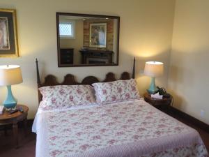 Postel nebo postele na pokoji v ubytování Madison Manor Boutique Hotel