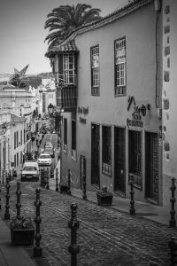 a black and white photo of a street with a building at Hotel Rural Orotava in La Orotava