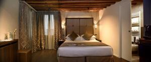 Postel nebo postele na pokoji v ubytování Rosa Salva Hotel