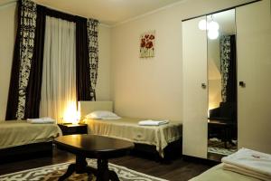A bed or beds in a room at Guest house Altay