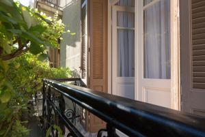 a balcony with a door on a house at Trilogy Experimental in Thessaloniki