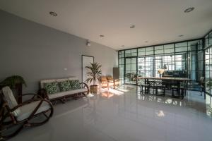 a living room with a couch and a table at S44ROOM in Bangkok