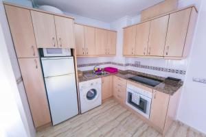 Kuchyň nebo kuchyňský kout v ubytování Homely Apartments Blasco Ibañez