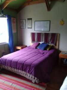 מיטה או מיטות בחדר ב-Parcela 9 Nehuen
