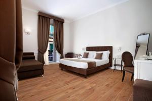 Posteľ alebo postele v izbe v ubytovaní La Fontanina Suites
