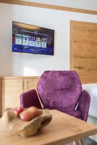 TV a/nebo společenská místnost v ubytování Gasthof Ellmauer Hof