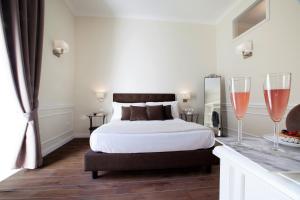 Posteľ alebo postele v izbe v ubytovaní La Fontanina Suites