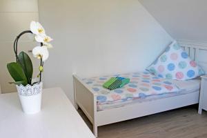 Postel nebo postele na pokoji v ubytování Ferienwohnung Sellin am Seepark + 14 fotografií