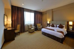 Ένα ή περισσότερα κρεβάτια σε δωμάτιο στο Lintas View Hotel