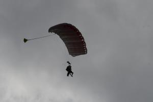 a person is hanging from a parachute at Appartement dans maison Entre Savines et Embrun in Crots