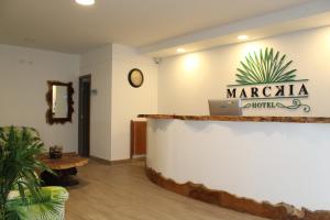 a lobby with a counter with a sign for maragogica at Hotel Ayenda Marckia 1901 in Armenia