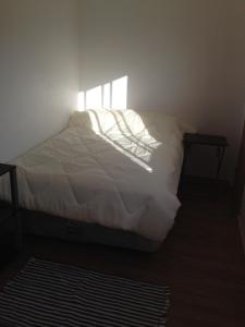 Tempat tidur dalam kamar di Mumus