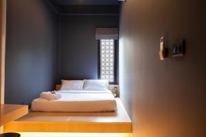 A bed or beds in a room at CLOUD on Saladaeng Silom Hostel Bangkok