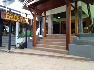 a restaurant with stairs leading into a building at Phi Phi Inn in Phi Phi Islands