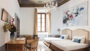 Postel nebo postele na pokoji v ubytování Nobildonne Relais