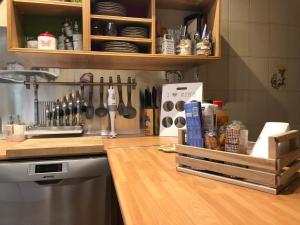 a kitchen with a counter top with a wooden counter top at Luxury Apartment in Tivoli