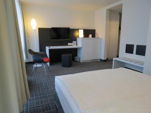 Postel nebo postele na pokoji v ubytování Comfor Hotel Ulm City