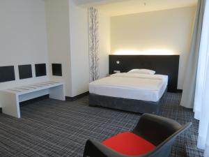 Postel nebo postele na pokoji v ubytování Comfor Hotel Ulm City