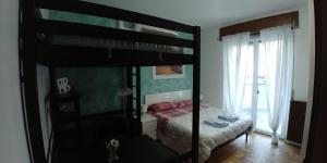 Postel nebo postele na pokoji v ubytování AFFITTACAMERE VALCHIAVENNA - Foresteria Lombarda con PARCHEGGIO PRIVATO SUL POSTO! Apprezzata Gestione Familiare dal 2012, Qualità-Prezzo TOP! "Guest-House with PRIVATE PARKING ON SITE! Appreciated Family Management since 2012, Quality-Price TOP!"