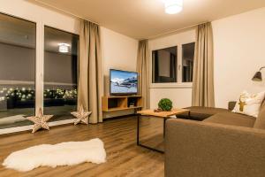 TV a/nebo společenská místnost v ubytování Appartements Ausblick