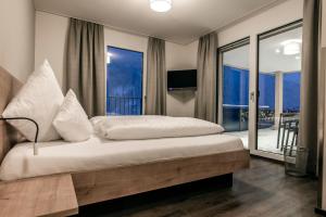 Postel nebo postele na pokoji v ubytování Appartements Ausblick