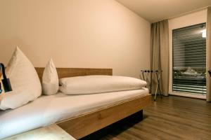 Postel nebo postele na pokoji v ubytování Appartements Ausblick