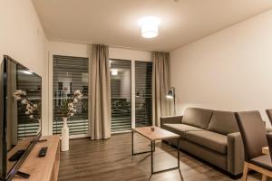 TV a/nebo společenská místnost v ubytování Appartements Ausblick