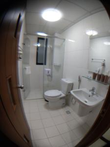 a bathroom with a toilet and a shower and a sink at Lan-inn in Yujing +14 photos