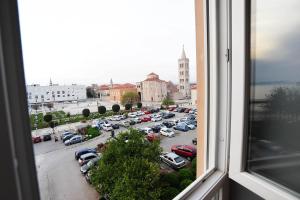 a view through a window of a city street at Luxury Town Center Apartments in Zadar