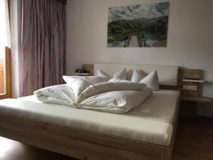 Posteľ alebo postele v izbe v ubytovaní Landhaus Engadin