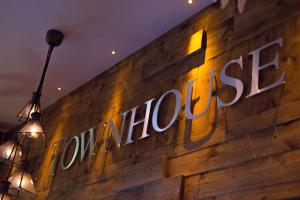 a sign on the side of a building with lights at The Townhouse Boutique Hotel in Barrow in Furness